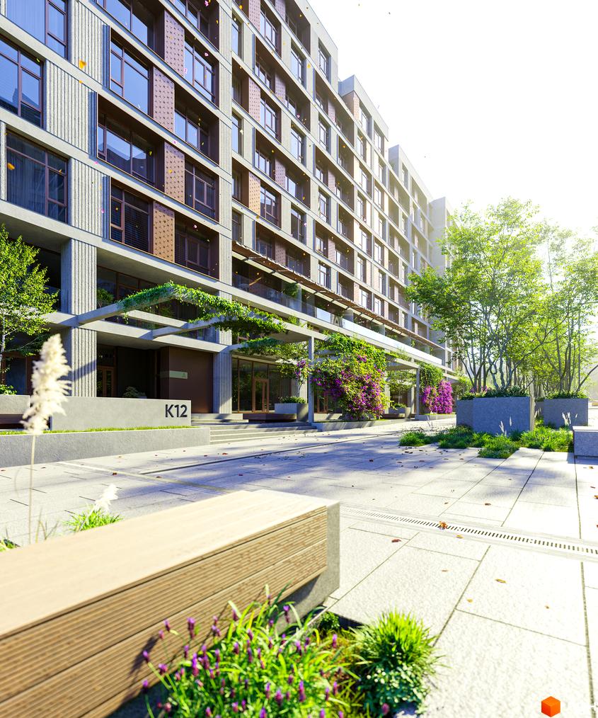 Клубний будинок К12 з фасадом з сірого каменю та великими вікнами, зеленою зоною з квітами та деревами.