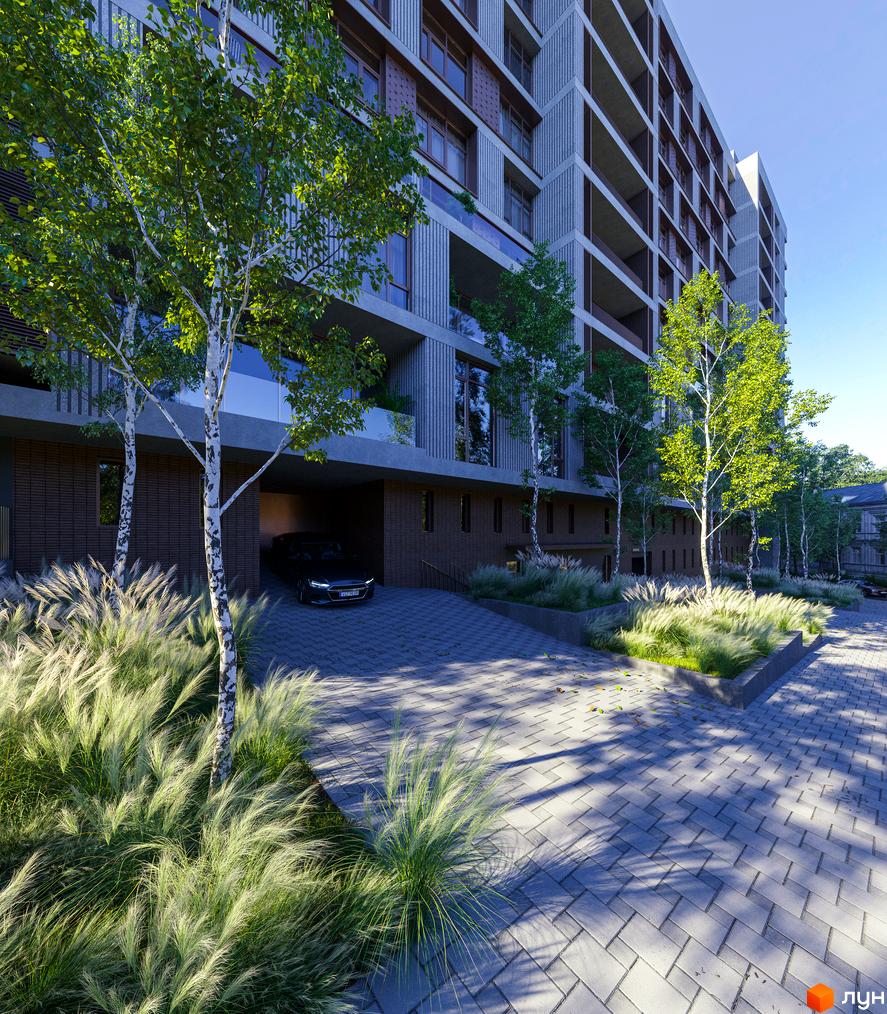 Клубний будинок К12 з елегантною фасадною обробкою та просторою прибудинковою територією з деревами та декоративними травами.