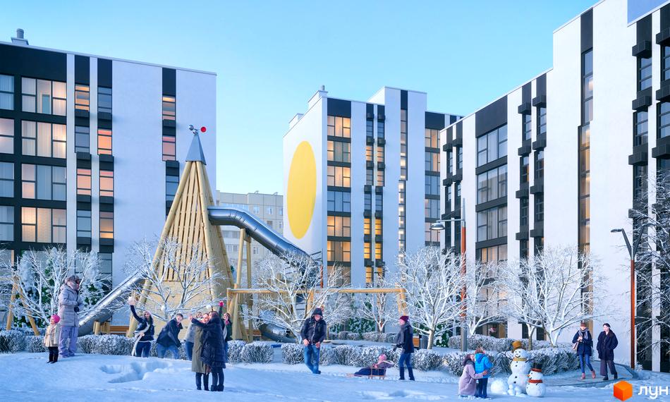 Житловий комплекс Сонячний. Сучасна архітектура будинків з великими вікнами та дитячим майданчиком у зимовому парку.