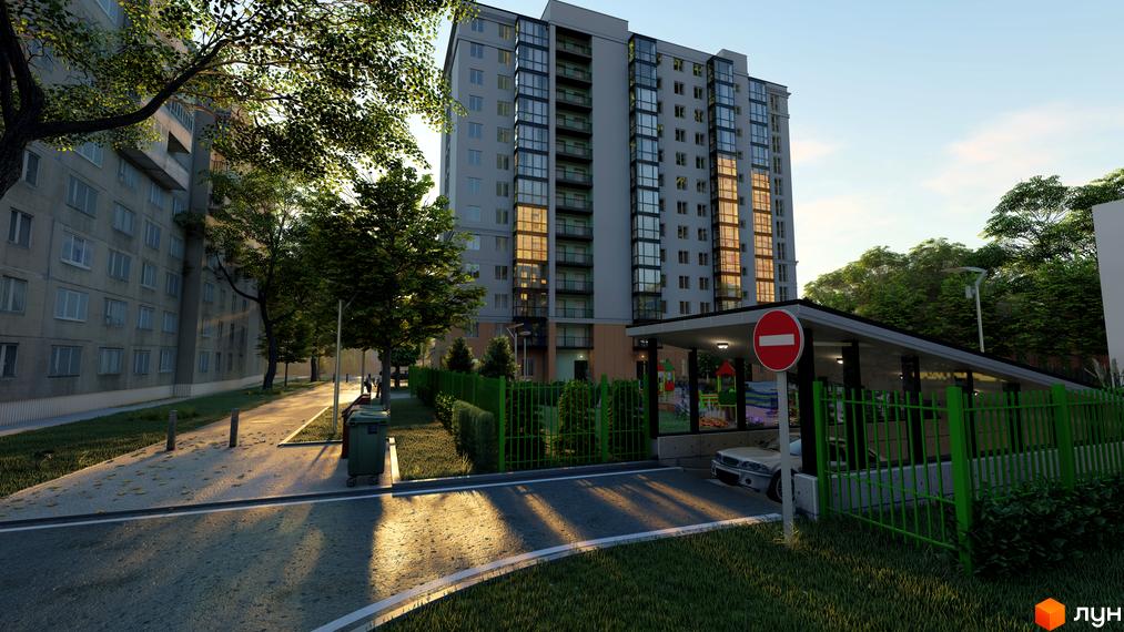 Новобудова Янтарний з фасадом з вікон та балконів, зеленою огорожею та дитячим майданчиком. Зовнішній вигляд будинку та прибудинкової території.