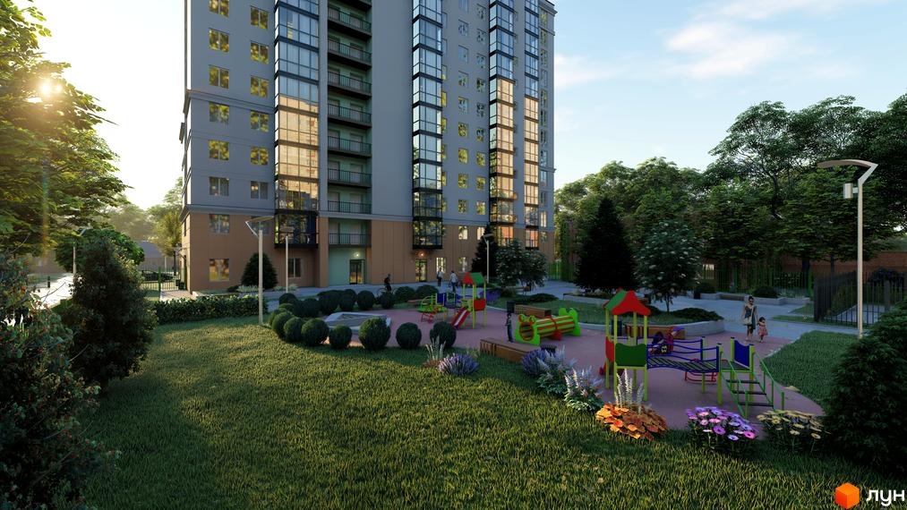 Житловий комплекс Янтарний з дитячим майданчиком та зеленою зоною. Сучасна архітектура будинку з великими вікнами та балконами.