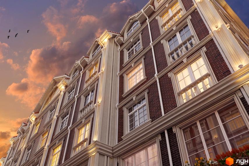 Зовнішній вигляд будинку в Житловому комплексі British Quarter. Фасад з червоної цегли, великі вікна та декоративні елементи.