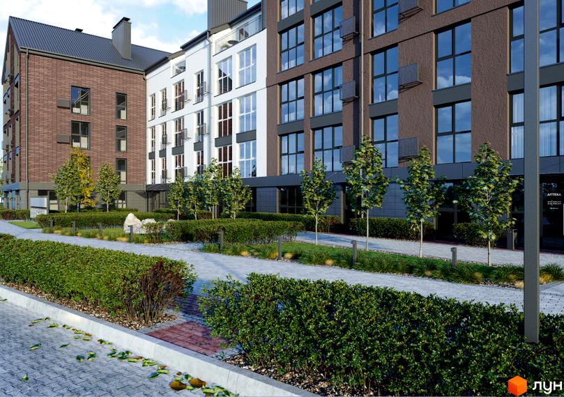 Зовнішній вигляд житлового комплексу Амстердам з цегляним та білим фасадами, великими вікнами та доглянутою прибудинковою територією з кущами та деревами.