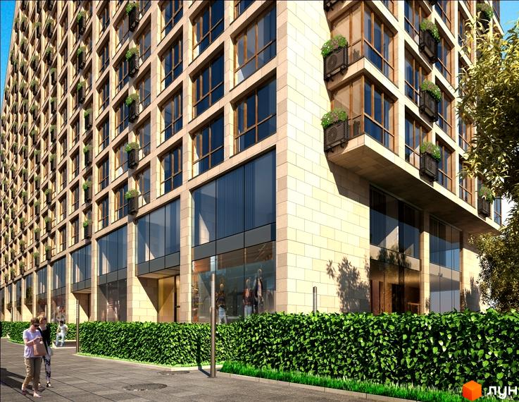 Зовнішній вигляд новобудови ЖК Хоффманн Хаус з кам'яним фасадом та великими вікнами. Перед будинком зелений газон та доріжка.