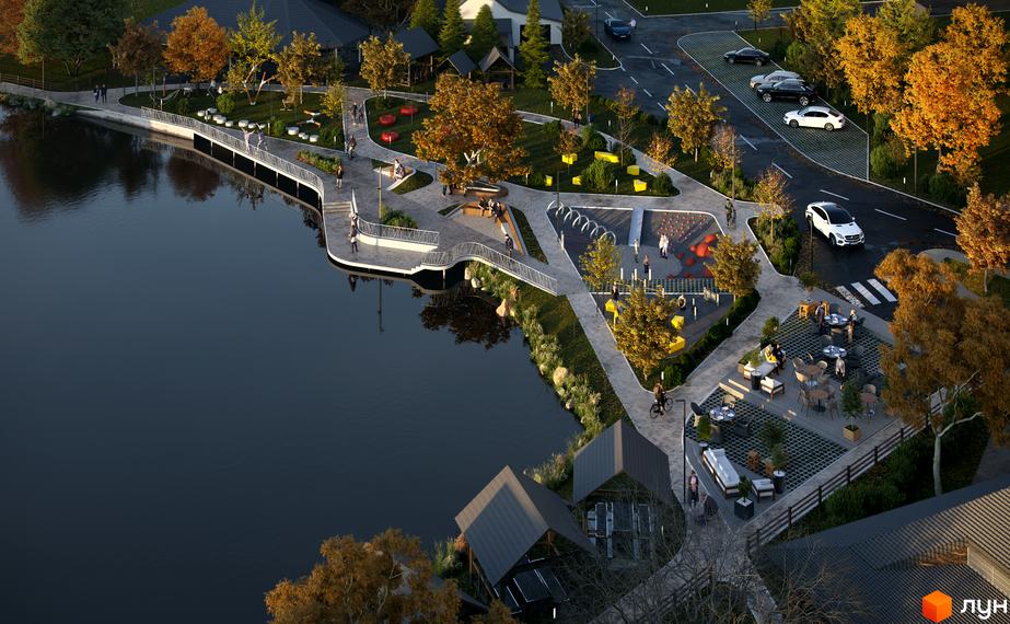 Вигляд з висоти пташиного польоту на Будівельний проєкт Pictorial з ландшафтним дизайном, озером та місцями для відпочинку.