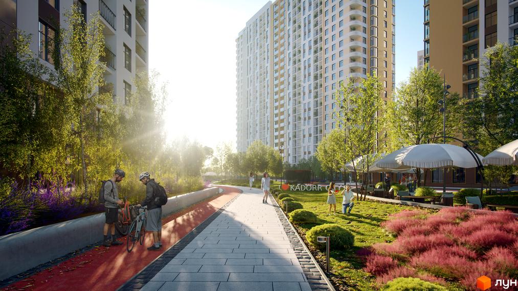 Житловий комплекс KADORR City з високими будинками та доглянутою прибудинковою територією з зеленими зонами та місцями для відпочинку.