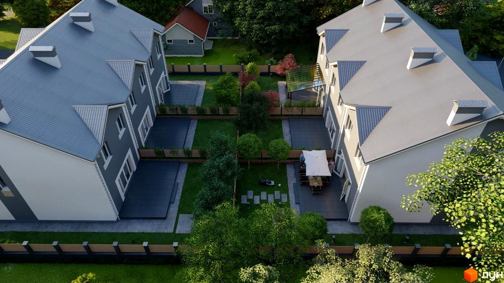 Вид зверху на два житлові будинки з сірими дахами та світлими фасадами. Прибудинкова територія включає зелені газони, дерева та мощені дворики.