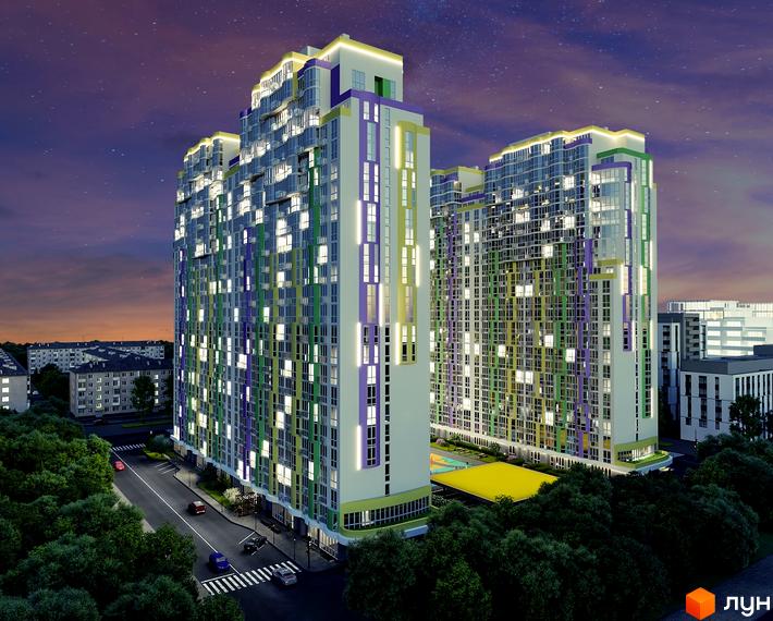 БФК Курнатовського - новобудова з яскравим фасадом у вечірньому освітленні. На прибудинковій території розташована дитяча зона та зелені насадження.