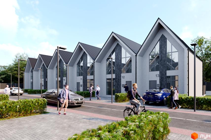 Таунхауси Scandi Village з гострими дахами та великими вікнами, розташовані вздовж дороги з зеленими насадженнями.