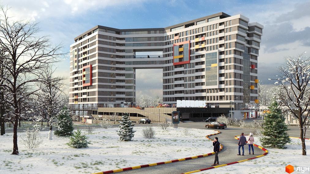 Житловий комплекс Bauhaus з унікальною аркою та зимовим пейзажем. Навколо комплексу розташовані дерева та засніжена територія.