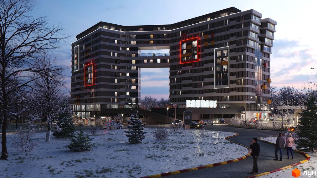 Житловий комплекс Bauhaus з унікальною архітектурою та підсвіткою в зимовий вечір. Навколо комплексу розташована прибудинкова територія зі снігом та деревами.