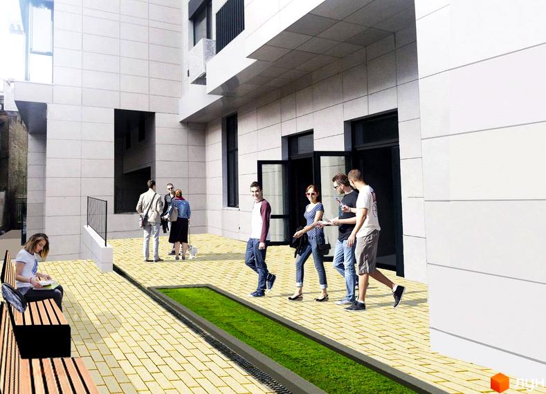 Житловий комплекс Ярославів Град з білими фасадами та вхідними групами. Прибудинкова територія з бруківкою та зеленою зоною.