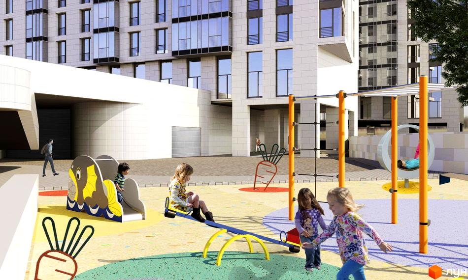 Житловий комплекс Ярославів Град. Дитячий майданчик з гіркою та гойдалкою біля багатоповерхових будинків.