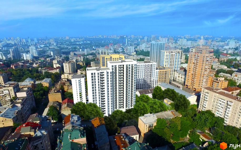 Житловий комплекс Ярославів Град - це сучасна новобудова з білими фасадами та великою кількістю вікон, оточена зеленими деревами. Комплекс розташований у міському середовищі з іншими висотними будівлями.