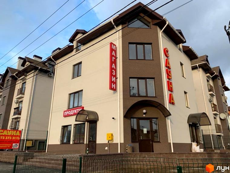 Зовнішній вигляд новобудови ЖК Петрівський з червоними вивісками