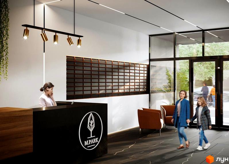 Вхідна група Житлового комплексу M.Park з рецепцією, поштовими скриньками та зоною очікування. За великими скляними дверима проглядається зелена прибудинкова територія.