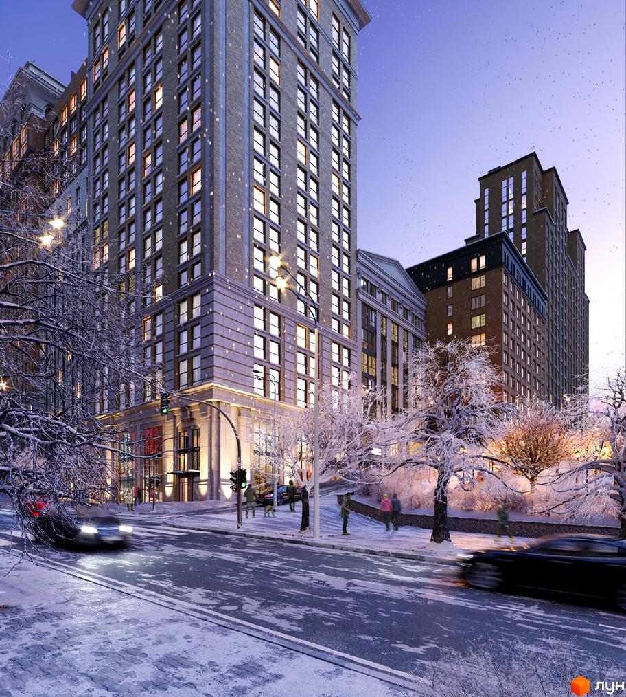 Зображення фасаду ЖК Stanford взимку. Вигляд багатоповерхового будинку з великою кількістю вікон та засніженими деревами біля нього.
