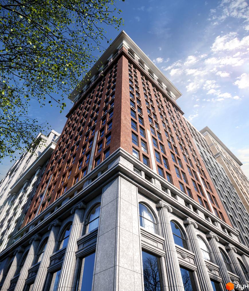 Висотна будівля ЖК Stanford з цегляним фасадом та великими вікнами. Архітектура будівлі класична, з колонами та декоративними елементами. Небо блакитне з хмарами, видно дерева.