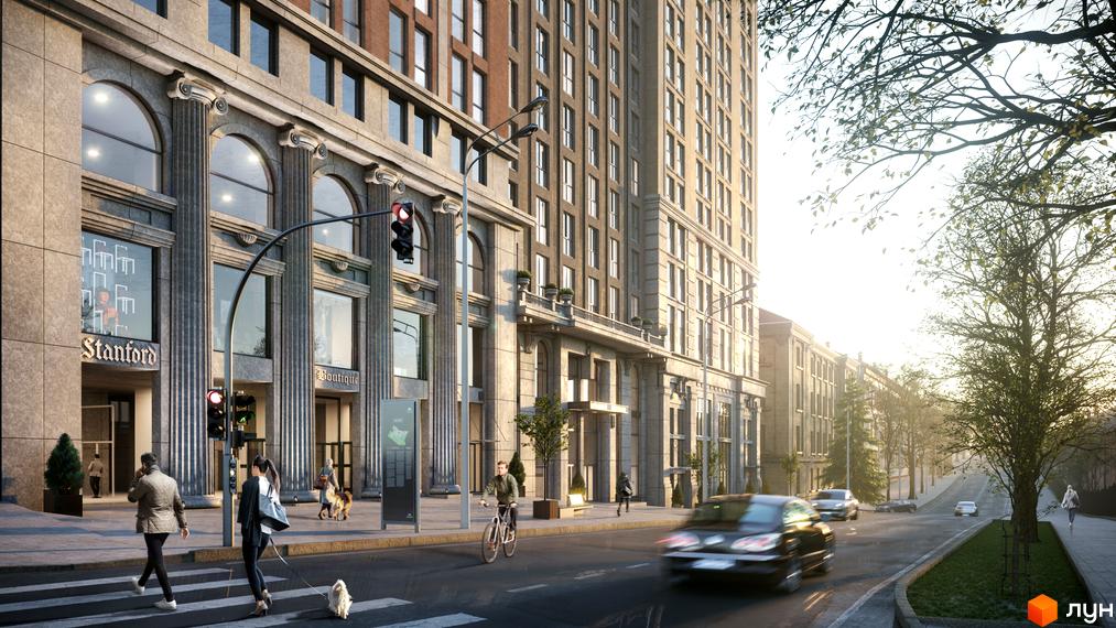 Житловий комплекс Stanford з колонами та арковими вікнами. На вулиці видно машини, пішоходів та зелені насадження.