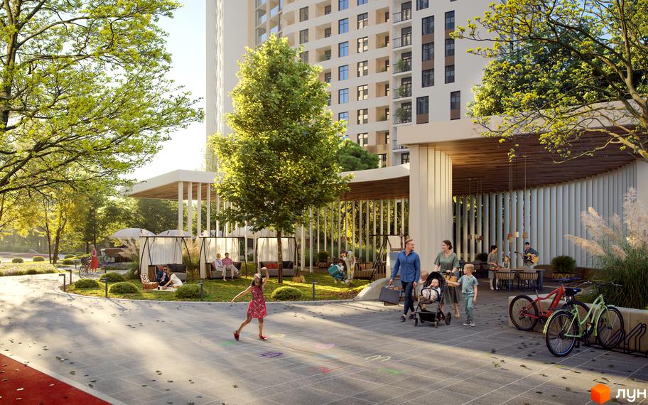 Житловий комплекс KADORR City: висотна будівля та доглянута прибудинкова територія з зонами відпочинку та дитячим майданчиком.