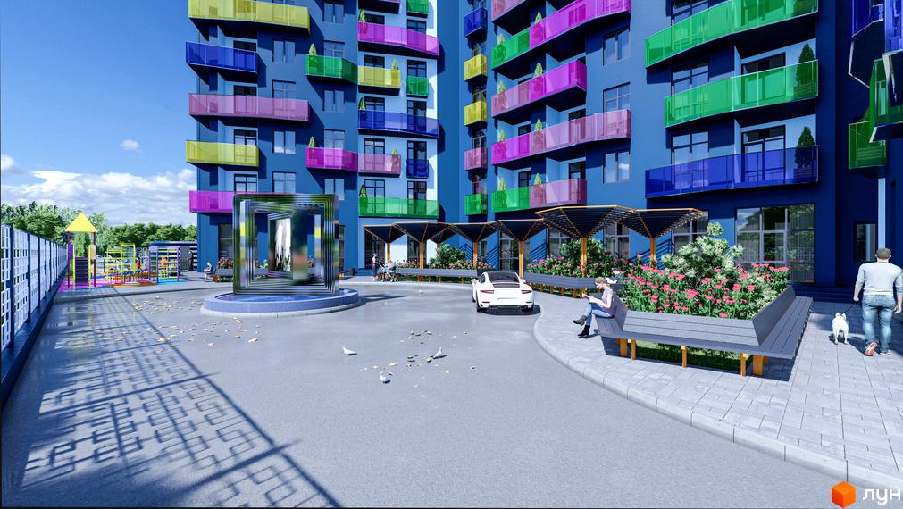 Житловий комплекс Калейдоскоп з яскравими балконами та доглянутою прибудинковою територією з дитячим майданчиком та місцями для відпочинку.