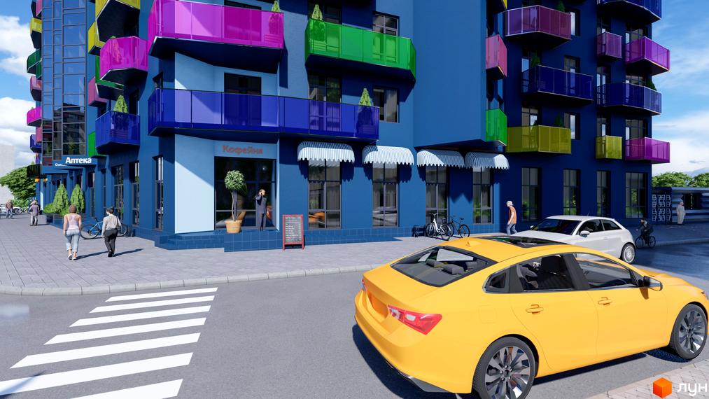 Житловий комплекс Калейдоскоп з яскравими балконами та синім фасадом. Поруч пішохідний перехід та дорога з автомобілями.