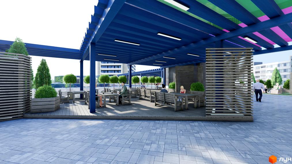 Житловий комплекс Калейдоскоп: затишна тераса з дерев'яними меблями та зеленню під синім навісом. Територія для відпочинку біля новобудови.