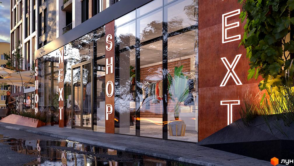 Фасад Житлового комплексу Mill Town з великими скляними вітринами. Навколо мокрий тротуар та зелені насадження.