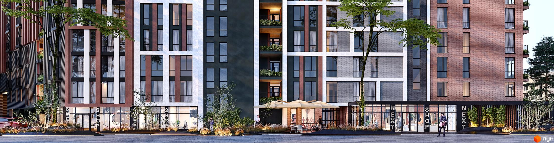 Фасад житлового комплексу Mill Town має цегляні, темні та світлі панелі, великі вікна. На першому поверсі розташовані магазини, кафе та озеленена територія.