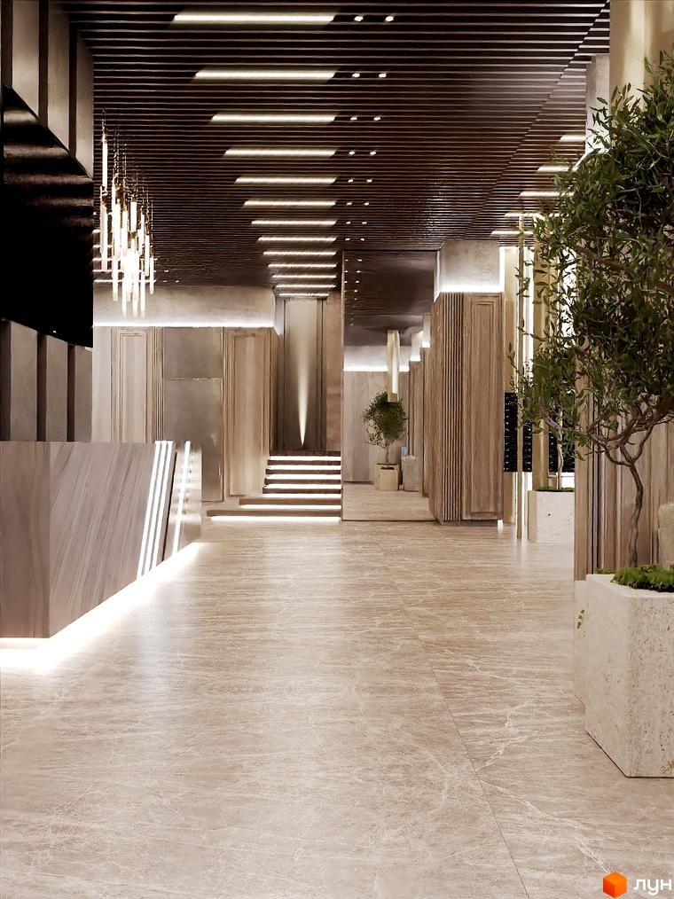 Інтер'єр холу Житлового комплексу Dynastia BC з ресепшеном, освітленням та декоративними рослинами.