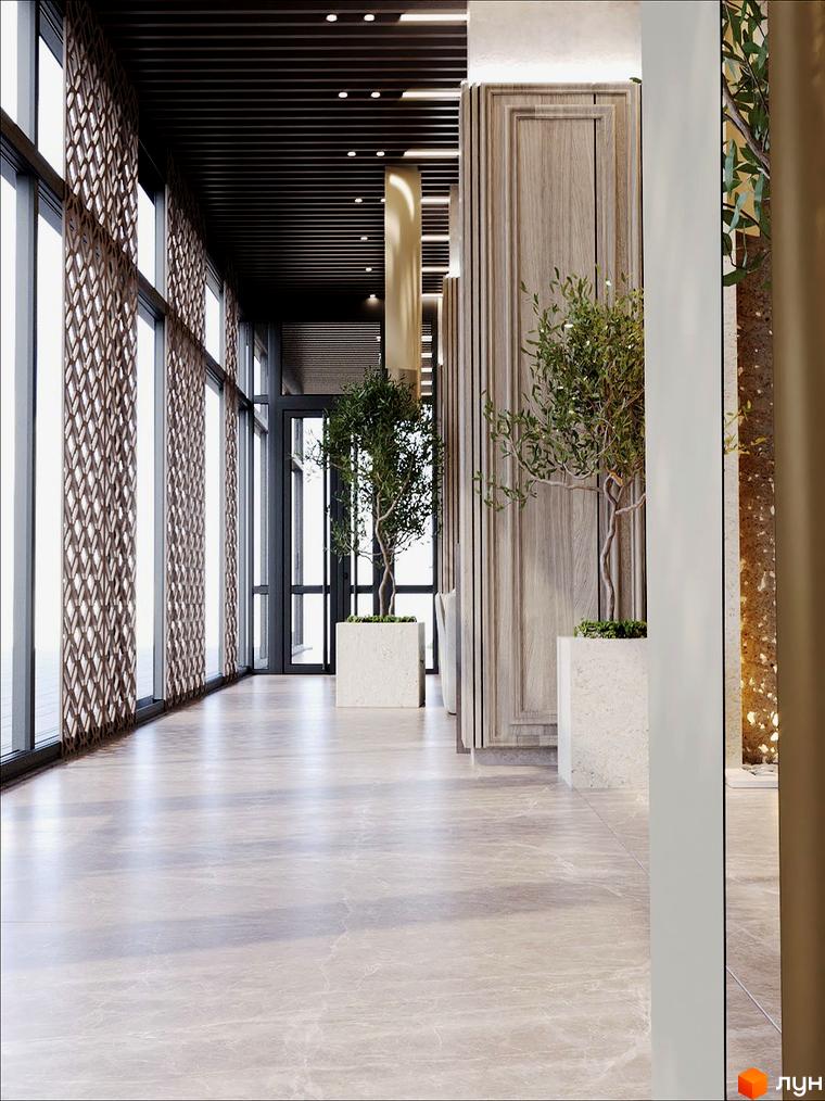 Інтер'єр Житлового комплексу Dynastia BC з великими вікнами та декоративними перегородками. Уздовж коридору розташовані рослини у вазонах.