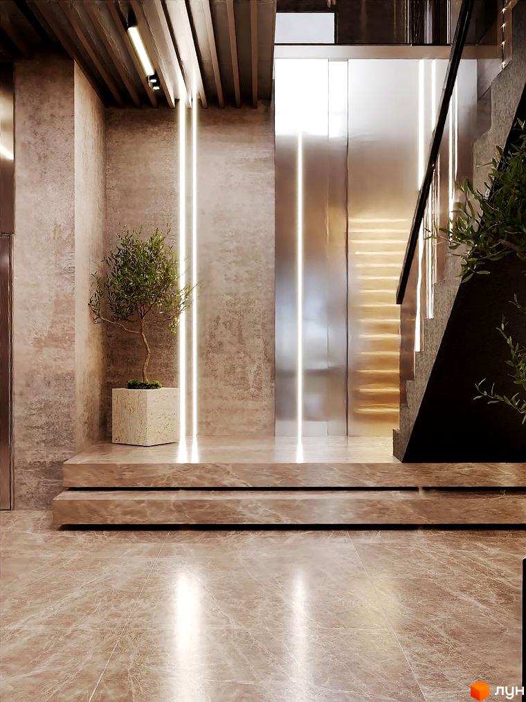 Інтер'єр холу в Будівельному проєкті Dynastia BC з деревом у горщику та сходами. Оздоблення стін і підлоги виконано в бежевих тонах.