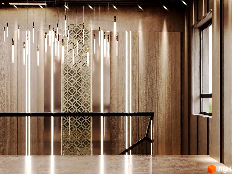 Інтер'єр холу Житлового комплексу Dynastia BC з декоративними панелями та освітленням. Вигляд сходової зони з чорними поручнями.