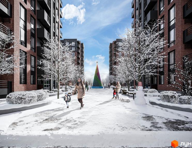 Житловий комплекс West Towers. Новобудова з цегляним фасадом та балконами. Прибудинкова територія вкрита снігом, з ялинкою та сніговиком.