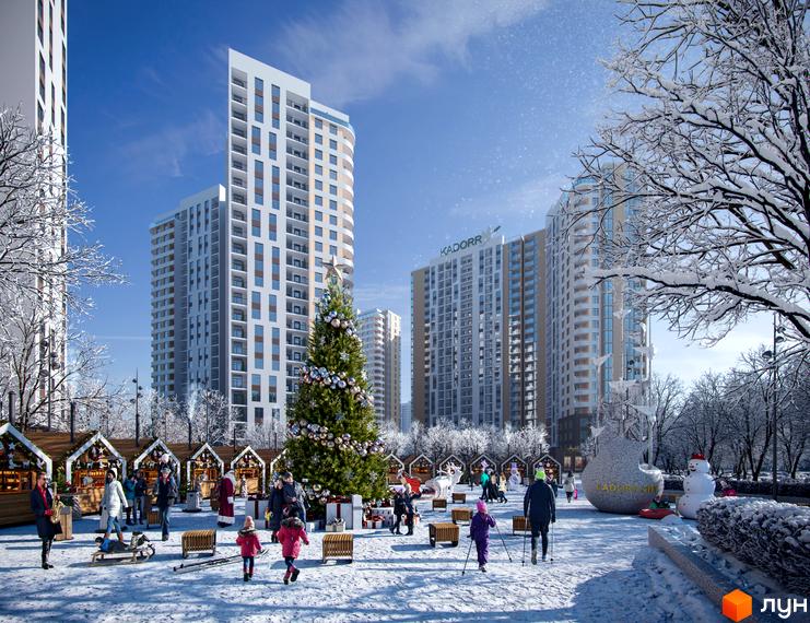 Житловий комплекс KADORR City взимку з різдвяною ялинкою та ярмарком. Сучасні висотні будинки на тлі блакитного неба.