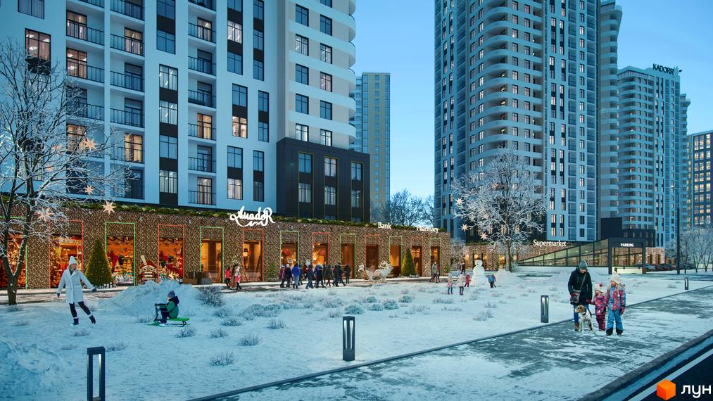 Житловий комплекс KADORR City взимку з новорічними прикрасами та людьми, що гуляють поруч. Зовнішній вигляд будівель та прибудинкової території.
