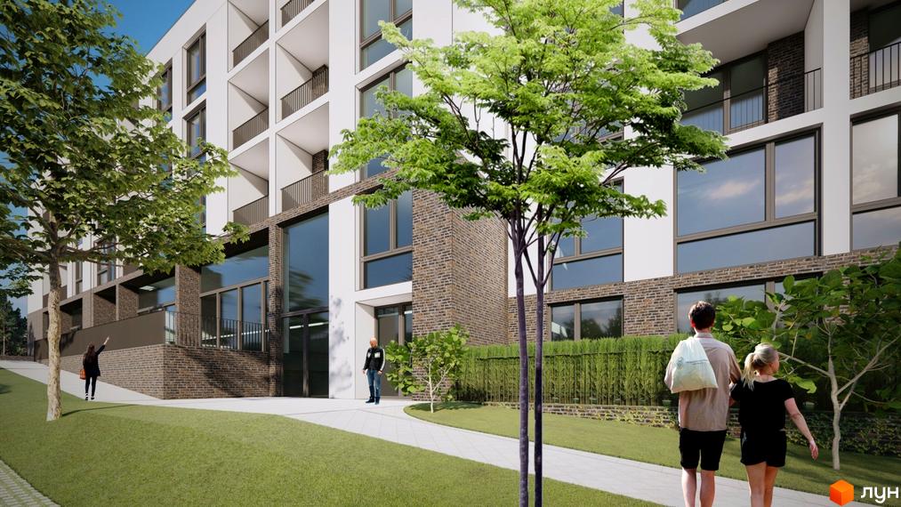 Зовнішній вигляд житлового комплексу Горизонт з цегляним фасадом та великими вікнами. На прибудинковій території зелена галявина та доріжка.