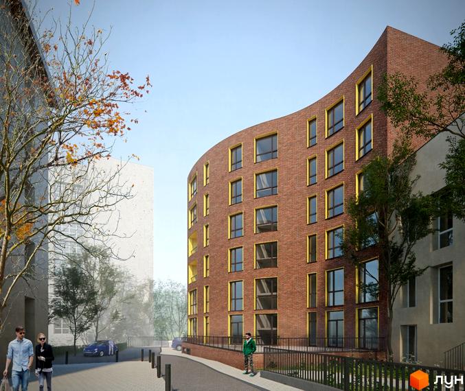 Зовнішній вигляд житлового комплексу Там Де Дім з цегляним фасадом та жовтими вікнами. Поруч розташована прибудинкова територія з деревами та пішохідною зоною.