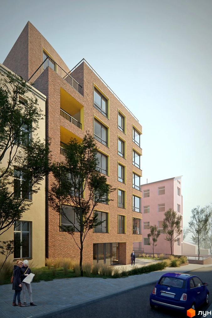 Зовнішній вигляд житлового комплексу Там Де Дім з цегляним фасадом та балконами. На прибудинковій території розташовані дерева та тротуар з пішоходами.