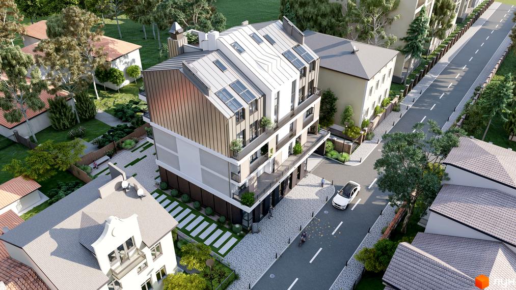 Житловий комплекс На Кондукторській з багатоскатним дахом та мансардними вікнами. Навколо будинку доглянута територія з зеленими насадженнями та дорогою.