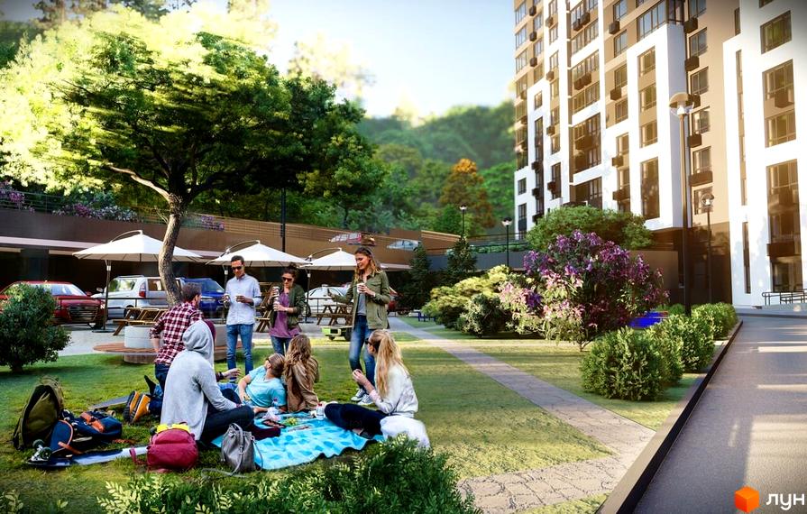 Зовнішній вигляд житлового комплексу Львівський з прибудинковою територією та місцями для відпочинку. Насолоджуйтесь комфортом та зеленню біля вашого дому.