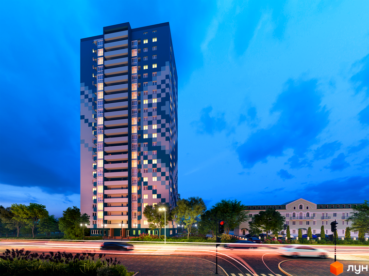 Житловий комплекс Вишиванка – висотна будівля з піксельним фасадом та балконами, розташована поруч з іншою будівлею та дорогою з автомобілями ввечері.