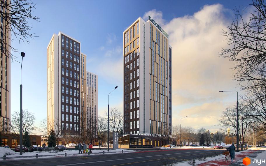 Житловий комплекс KADORR City з високими будівлями та сучасною архітектурою, розташований біля дороги з тротуаром та деревами.