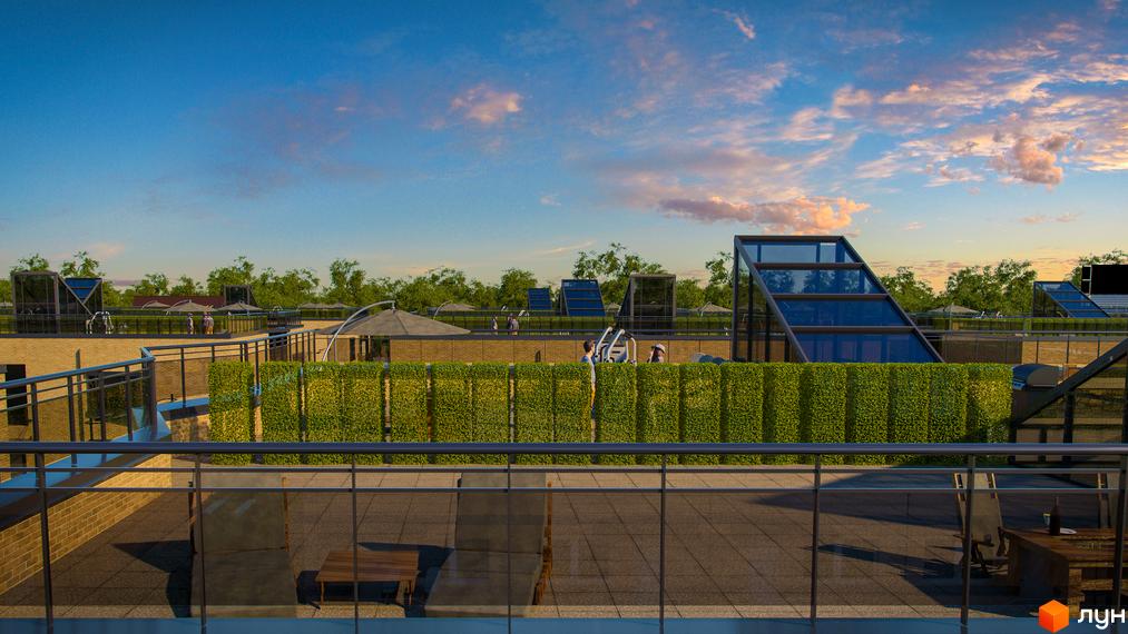 Житловий комплекс Європейський квартал: тераса з зеленою огорожею, скляними конструкціями та зонами відпочинку на даху.