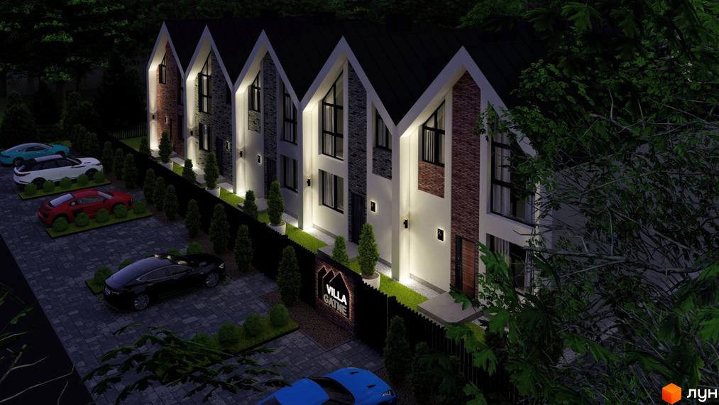 Зображення Котеджного містечка Villa Gatne вночі. На фото видно фасади будинків та припарковані автомобілі на прибудинковій території.