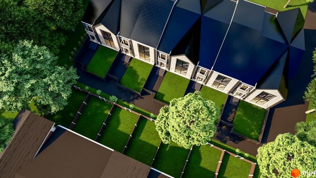 Зображення житлового комплексу з таунхаусами. На фото видно будинки з темними дахами та світлими фасадами, а також доглянуту прибудинкову територію з газонами та деревами.