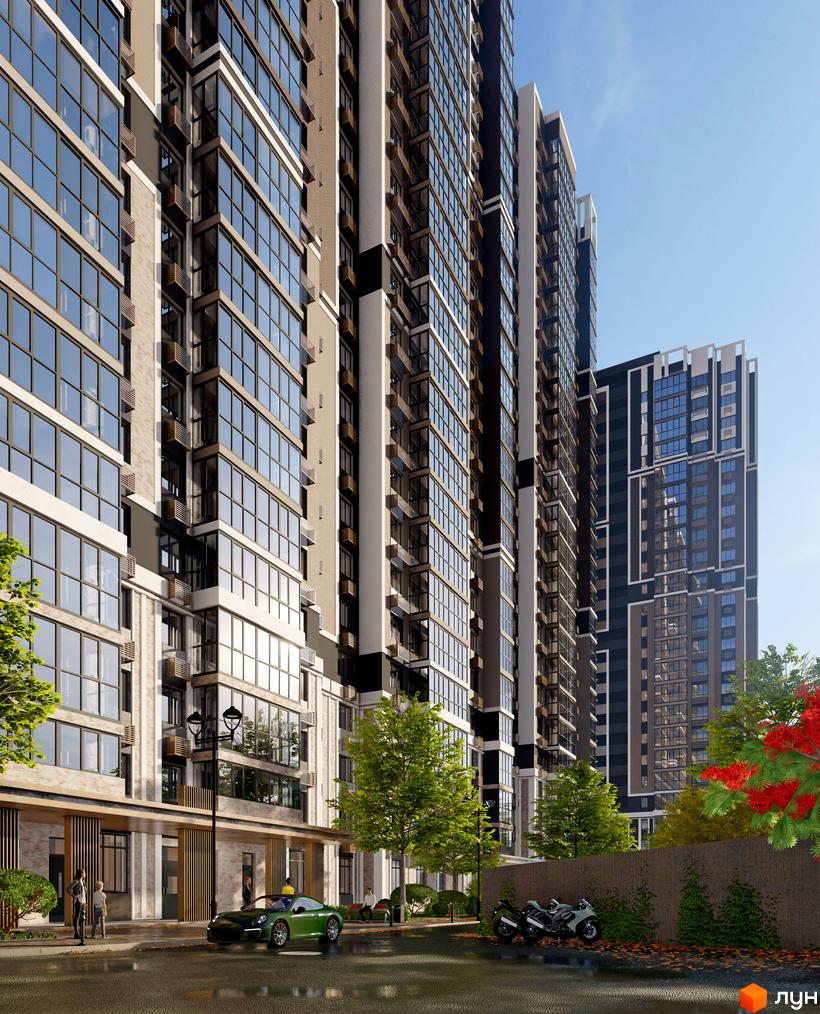 Зовнішній вигляд новобудови ЖК Голосіївський з великою кількістю скління та прибудинковою територією з деревами та автомобілями.