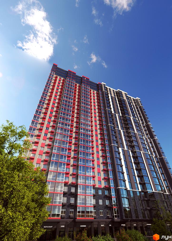 Фасад новобудови ЖК 4U з червоними та сірими елементами, великою кількістю скління та зеленими деревами на передньому плані. Висотна будівля під блакитним небом з хмарами.