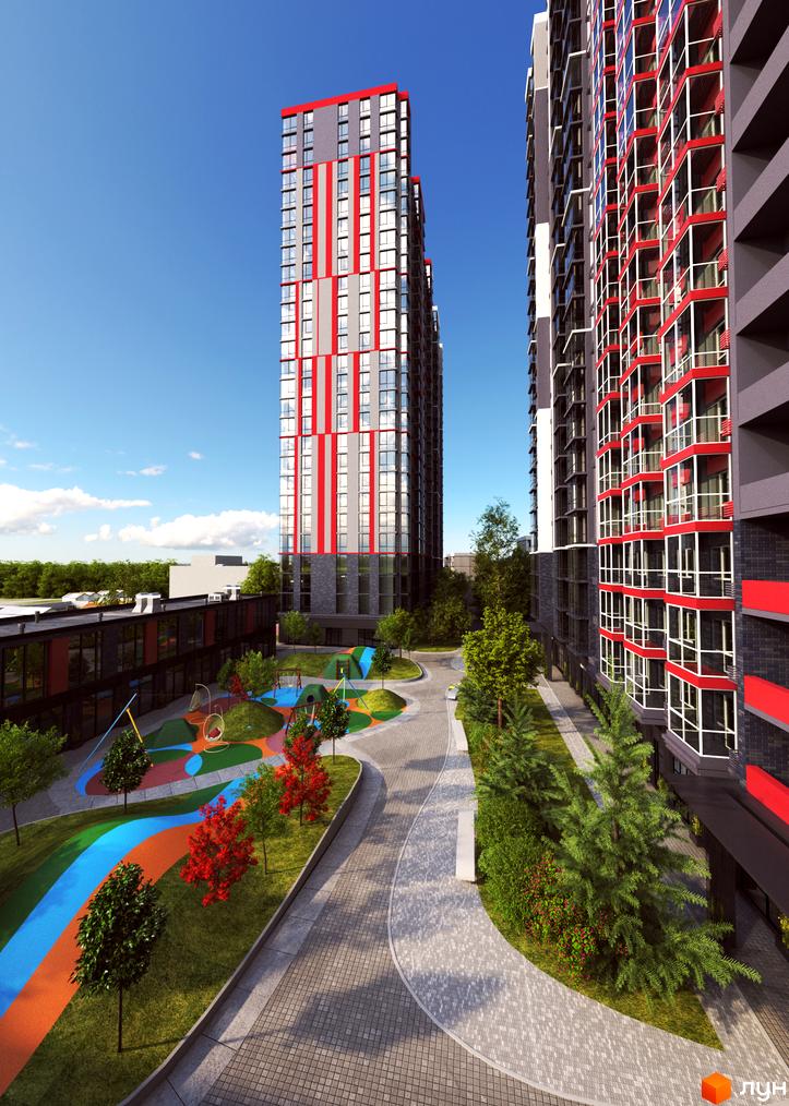Житловий комплекс 4U з яскравим фасадом та сучасною прибудинковою територією з дитячим майданчиком.
