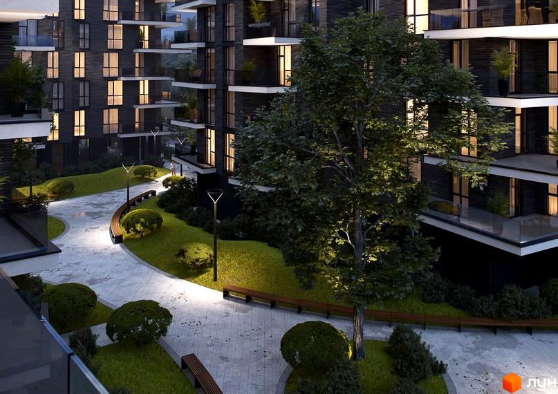 Житловий комплекс Artynov Hall з темними фасадами та світлими балконами. Доглянута прибудинкова територія з зеленими насадженнями та освітленням.